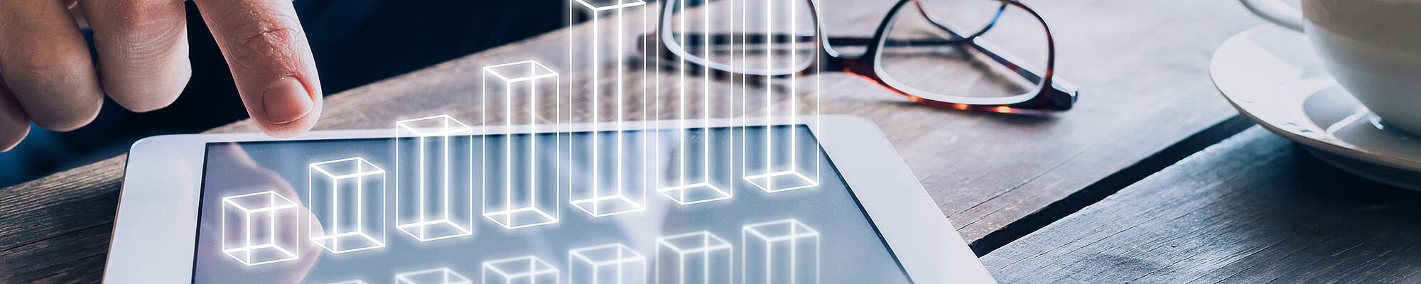 Tablet aus dem ein Balkendiagramm wächst